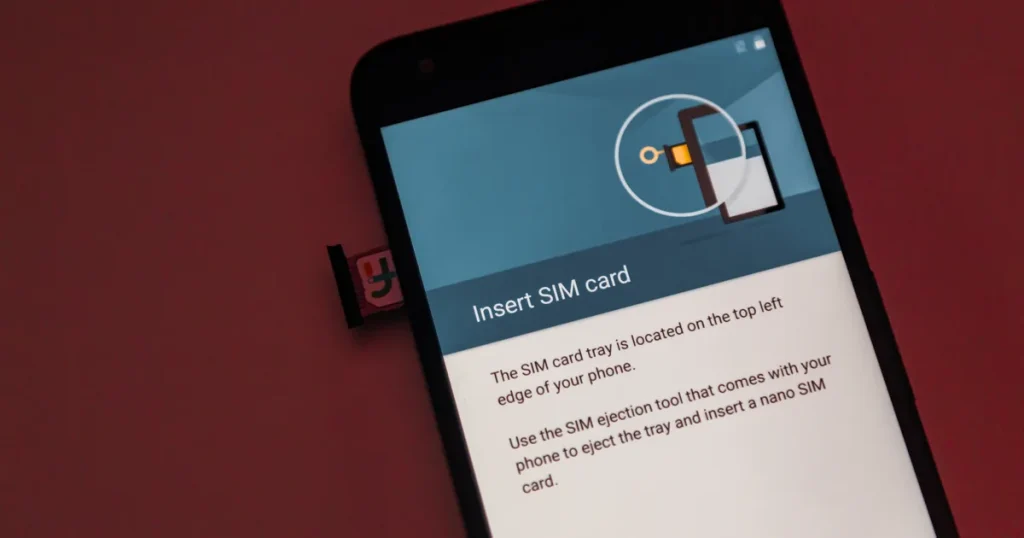 Smartphone screen showing Insert SIM card instructions next to an ejected nano SIM tray